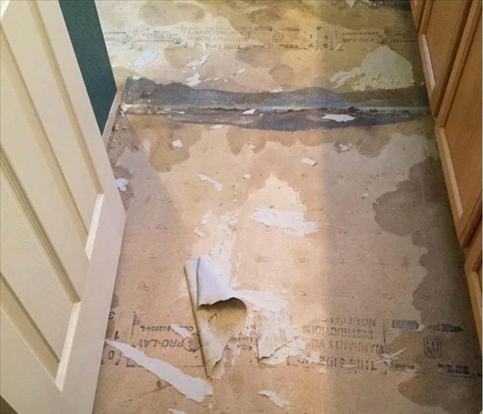 Damaged flooring after water leak