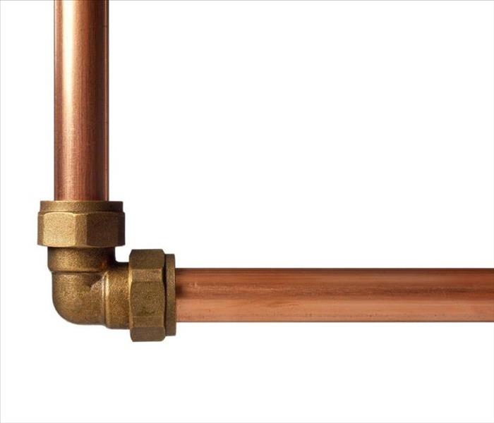Copper pipe on white with connector